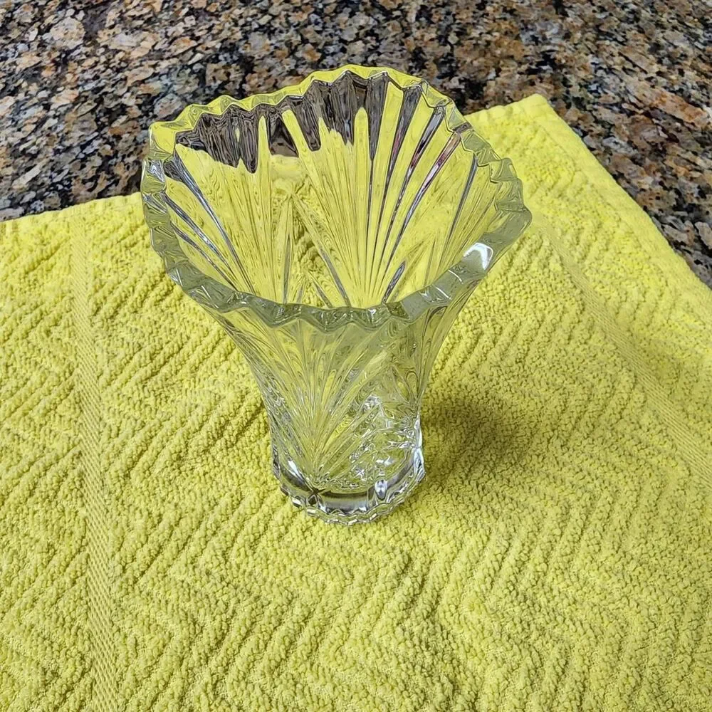 Clear heavy small glass vase approximately 4.75 inches tall